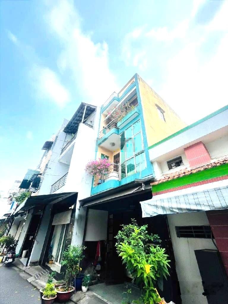 Ngay trường học lê văn tám - trung tâm sầm uất tân phú - hẻm xe hơi thông- dt 40m2- 3 tầng